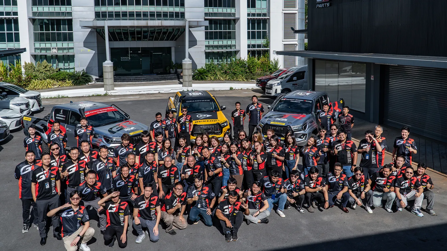 TCD Asia team members with customized vehicles