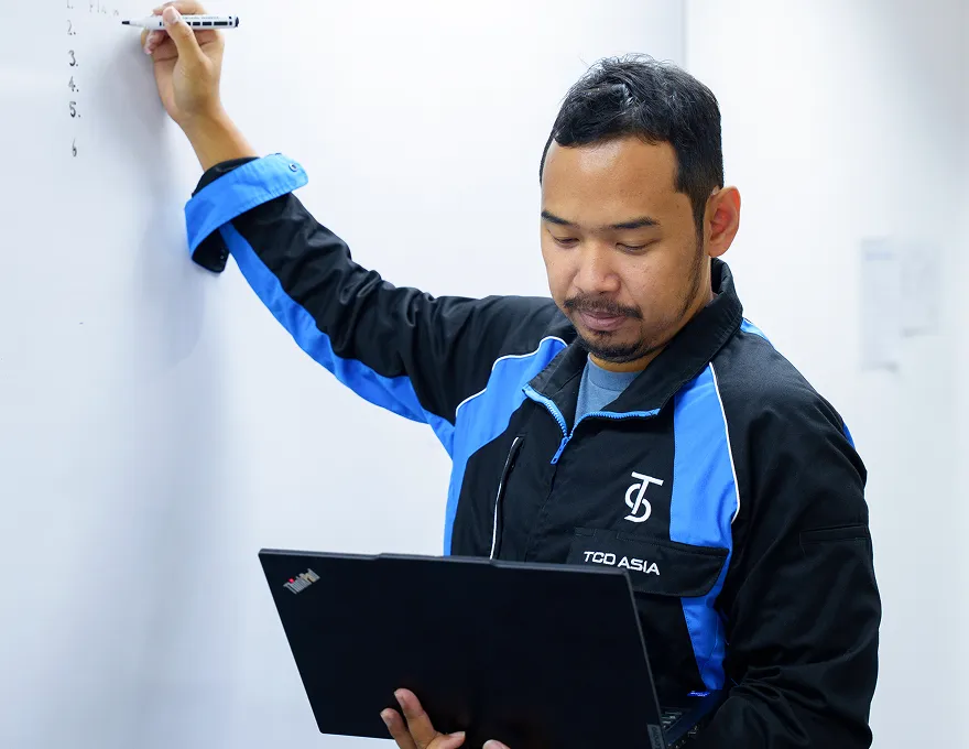 Apisith working with colleagues
