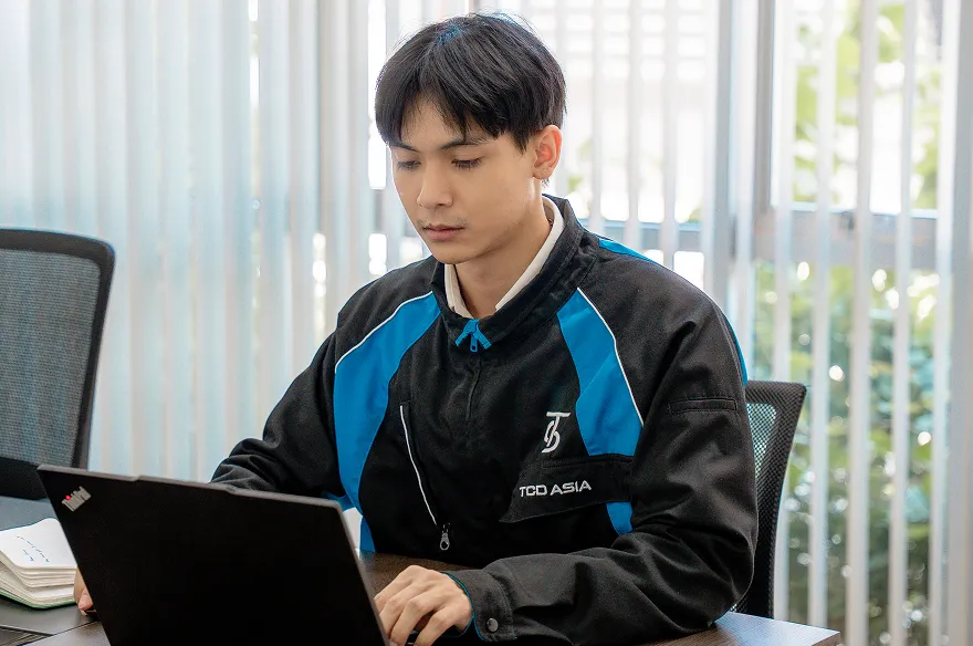 Kutai working with colleagues